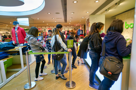 HONG KONG - JANUARY 22, 2019: people queue at Bossini shop in Hong Kong.のeditorial素材