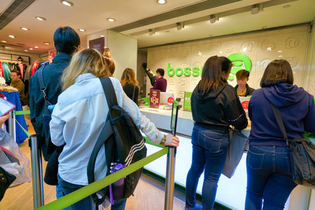 HONG KONG - JANUARY 22, 2019: people queue at Bossini shop in Hong Kong.