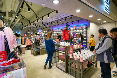 HONG KONG, CHINA - JANUARY 23, 2019: people shopping at Adidas store at New Town Plaza shopping mall...