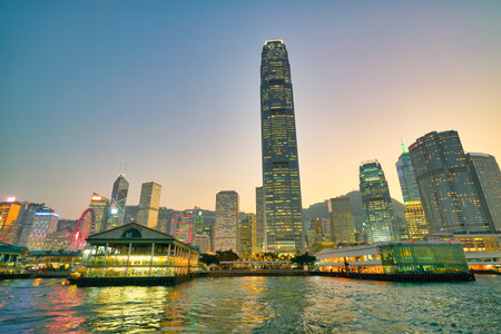 HONG KONG, CHINA - CIRCA JANUARY, 2019: view of the Central Ferry Piers with Central District in the background as seen from Victoria Harbour at twilight.のeditorial素材