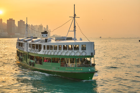 HONG KONG, CHINA - CIRCA JANUARY, 2019: a Star Ferry crossing Victoria Harbour. The Star Ferry is a passenger ferry service operator and tourist attraction in Hong Kong.のeditorial素材