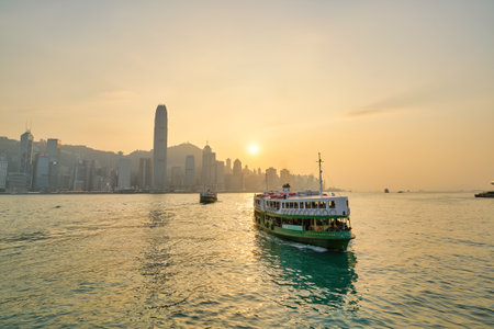 HONG KONG, CHINA - CIRCA JANUARY, 2019: a Star Ferry crossing Victoria Harbour. The Star Ferry is a passenger ferry service operator and tourist attraction in Hong Kong.のeditorial素材