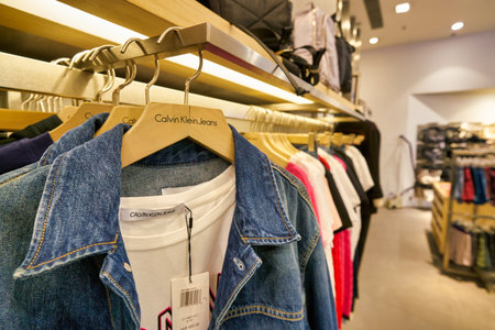HONG KONG, CHINA - JANUARY 23, 2019: clothes on display at Calvin Klein Jeans store in New Town Plaza. New Town Plaza is a shopping mall in the town centre of Sha Tin, Hong Kong.のeditorial素材