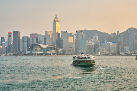 HONG KONG, CHINA - CIRCA JANUARY, 2019: a Star Ferry crossing Victoria Harbour. The Star Ferry is a passenger ferry service operator and tourist attraction in Hong Kong.のeditorial素材