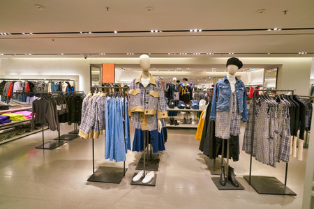 HONG KONG, CHINA - JANUARY 23, 2019: clothes on display at Zara store in New Town Plaza. New Town Plaza is a shopping mall in the town centre of Sha Tin, Hong Kong.のeditorial素材