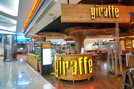 DUBAI, UAE - CIRCA JANUARY 2019: entrance to Giraffe World Kitchen at Dubai International Airport.のeditorial素材