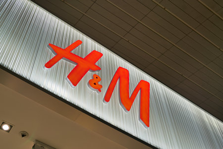 DUBAI, UAE - CIRCA FEBRUARY, 2019: close up shot of H&M sign seen in Dubai International Airport.のeditorial素材
