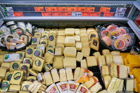 BERLIN, GERMANY - CIRCA SEPTEMBER, 2019: cheese display in Kaufland in Berlin. Kaufland is a German hypermarket chain, part of the Schwarz Gruppe which also owns Lidl and Handelshof.のeditorial素材