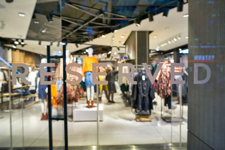 BERLIN, GERMANY - CIRCA SEPTEMBER, 2019: close up shot of Reserved sign seen on glass at a store in Berlin. Reserved is a Polish clothing store chain.のeditorial素材