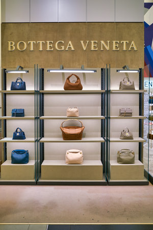 BERLIN, GERMANY - CIRCA SEPTEMBER, 2019: Bottega Veneta bags on display at the Kaufhaus des Westens (KaDeWe) department store in Berlin.のeditorial素材