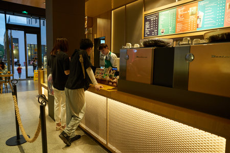 SHENZHEN, CHINA - CIRCA APRIL, 2019: people buying coffee in Starbucks at UpperHills in Shenzhen.