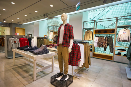 SINGAPORE - JANUARY 19, 2020: interior shot of H&M store in Singapore. H&M is a Swedish multinational clothing-retail company known for its fast-fashion clothing.のeditorial素材