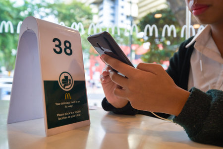 SINGAPORE - JANUARY 19, 2020: customer wait for order at McDonald's restaurant in Singapore.