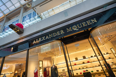SINGAPORE - JANUARY 20, 2020: Alexander McQueen brand name over a store entrance in the Shoppes at Marina Bay Sands. Alexander McQueen is a British luxury fashion house.のeditorial素材