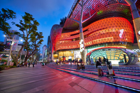 SINGAPORE - CIRCA JANUARY, 2020: street level view of ION Orchard shopping mall in Singapore in the evening.のeditorial素材