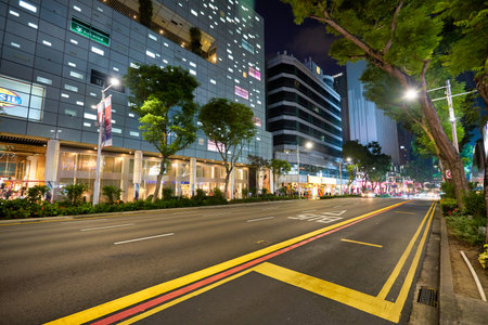 SINGAPORE - CIRCA JANUARY, 2020: street level view of Singapore at nighttime.のeditorial素材