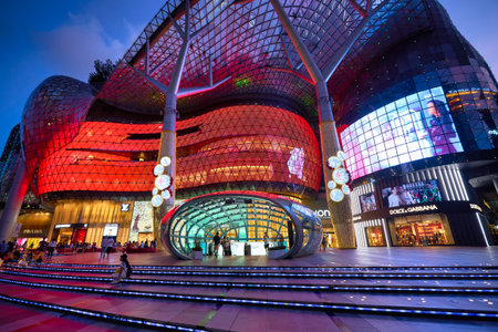 SINGAPORE - CIRCA JANUARY, 2020: street level view of ION Orchard shopping mall in Singapore in the evening.のeditorial素材