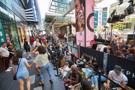 KUALA LUMPUR, MALAYSIA - JANUARY 18, 2020: people sit in line waiting for the grand opening of...