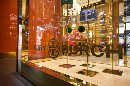 SINGAPORE - JANUARY 20, 2020: close up shot of Tory Burch sign seen in the Shoppes at Marina Bay Sands. Tory Burch LLC is an American fashion label.のeditorial素材