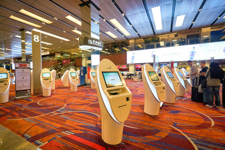 SINGAPORE - CIRCA JANUARY, 2020: self-service check-in facilities at Terminal 1, Changi Airport. Changi Airport is a major civilian airport that serves Singapore.のeditorial素材