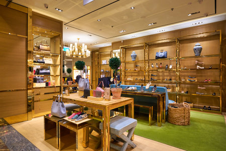SINGAPORE - CIRCA JANUARY, 2020: bags on display at Tory Burch store in Singapore Changi Airport.のeditorial素材