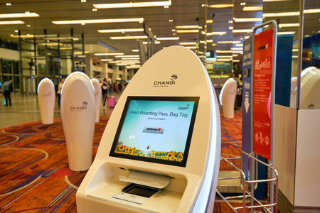 SINGAPORE - CIRCA JANUARY, 2020: self-service check-in facilities at Terminal 1, Changi Airport. Changi Airport is a major civilian airport that serves Singapore.のeditorial素材