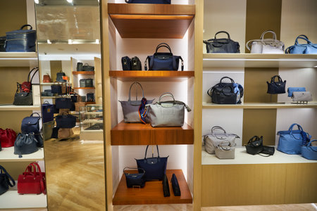SINGAPORE - CIRCA JANUARY, 2020: bags on display at Longchamp store in Singapore Changi Airport.のeditorial素材