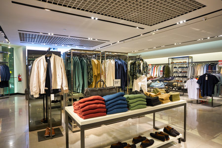 SINGAPORE - CIRCA JANUARY, 2020: clothes on display at Zara store in Singapore Changi Airport. Zara is a Spanish apparel retailer, specializes in fast fashion.のeditorial素材
