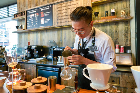 SHENZHEN, CHINA - CIRCA NOVEMBER, 2019: barista prepare coffee at Starbucks Reserve in Shenzhen.のeditorial素材