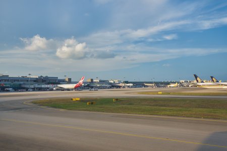SINGAPORE - CIRCA JANUARY, 2020: Changi International Airport seen from jet aircraft in the daytime.のeditorial素材