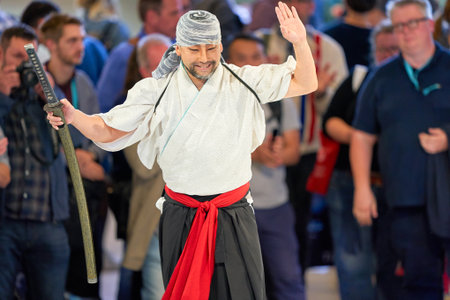 COLOGNE, GERMANY - CIRCA SEPTEMBER, 2018: Samurai Sword Show at Sony stand in Photokina.のeditorial素材