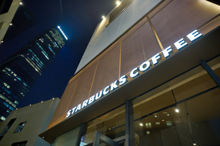SHENZHEN, CHINA - CIRCA NOVEMBER, 2019: Starbucks Coffee sign seen in Shenzhen at nighttime.