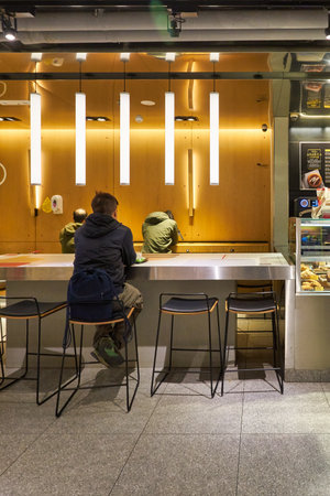 HONG KONG, CHINA - CIRCA DECEMBER, 2019: interior shot of McDonald's restaurant in Hong Kong. McDonald's is best known for its hamburgers, cheeseburgers and french fries.のeditorial素材