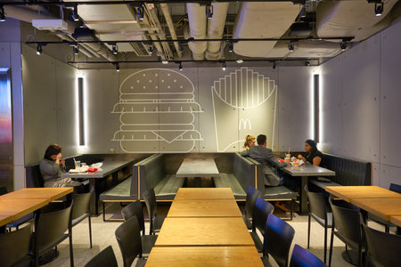 HONG KONG, CHINA - CIRCA DECEMBER, 2019: interior shot of McDonald's restaurant in Hong Kong. McDonald's is best known for its hamburgers, cheeseburgers and french fries.のeditorial素材