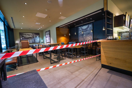 SAINT PETERSBURG, RUSSIA - CIRCA JULY, 2020: red white barrier tape at Starbucks Coffee in Pulkovo...