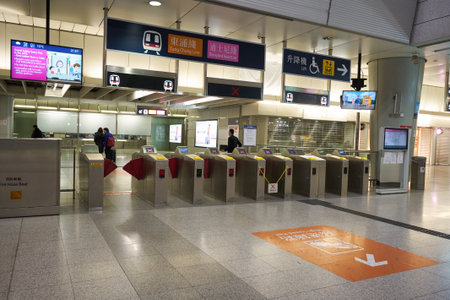 HONG KONG - CIRCA DECEMBER, 2019: metro bi-parting gates as seen at MTR station in Hong Kong. The Mass Transit Railway (MTR) is a major public transport network serving Hong Kong.のeditorial素材