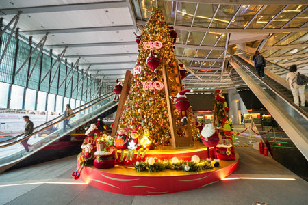 HONG KONG - CIRCA DECEMBER, 2019: Christmas tree decorated with ribbons, glass balls and Santa Claus figures as seen at HSBC Main Building in Hong Kong.のeditorial素材