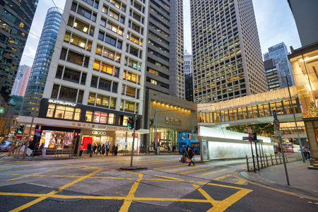 HONG KONG - CIRCA DECEMBER, 2019: street level view of Hong Kong urban landscape in the evening.