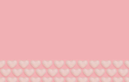 Top view photo with romantic food decoration. White marmalade in heart shape in rows on pink backdropの写真素材