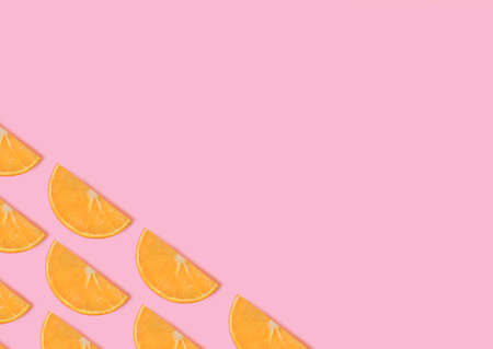 oranges. Design template with copy space. Slices of ripe orange on pink background. minimal style.