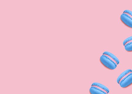 Almond cookies. top view photo. Blue colored macarons on pink background. Minimal styleの写真素材