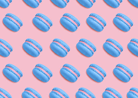 macaroons. Seamless pattern. Many blue almond french biscuits on pink background. Minimal styleの写真素材