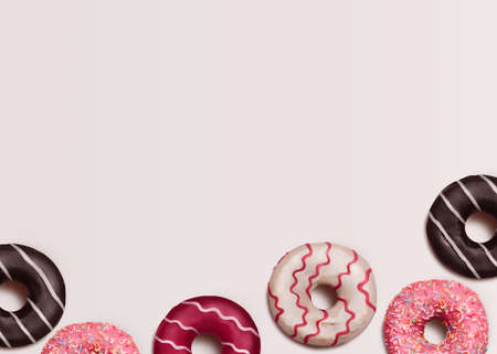 donuts. Template with copy space. Frosted donuts with toppings and sprinkles on white background
