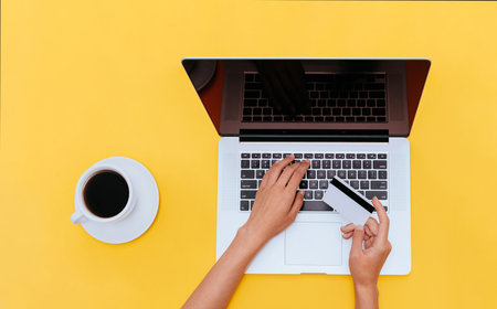 online shopping. Photo with copy space. Woman is entering data from a credit card into a laptopの写真素材