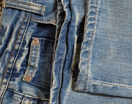 Folded blue jeansの写真素材