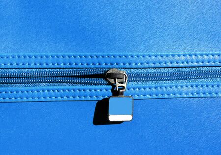 Fashion zipper on blue leatherの写真素材
