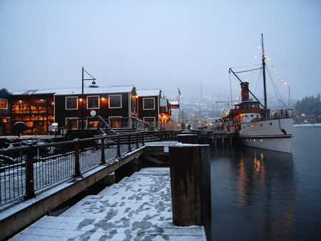 Old steamer at wharf in winterの写真素材