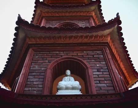 Sitting white buddha in the pagodaの写真素材