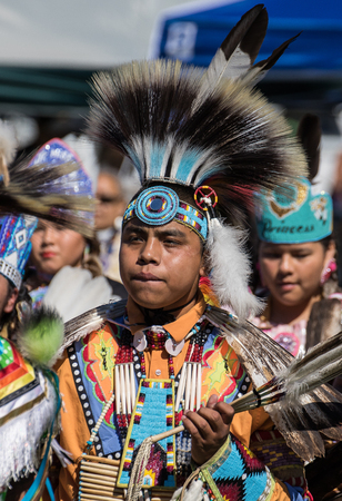 Anderson, California, USA-October 3, 2015: A Native American dancer performs a dance to the drums at...