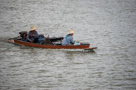Two Thai Locals on Chao Phraya River, Bangkok, Thailandのeditorial素材